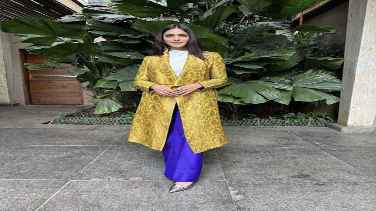 Mrunal was spotted wearing royal blue pants and a mustard-coloured brocade jacket