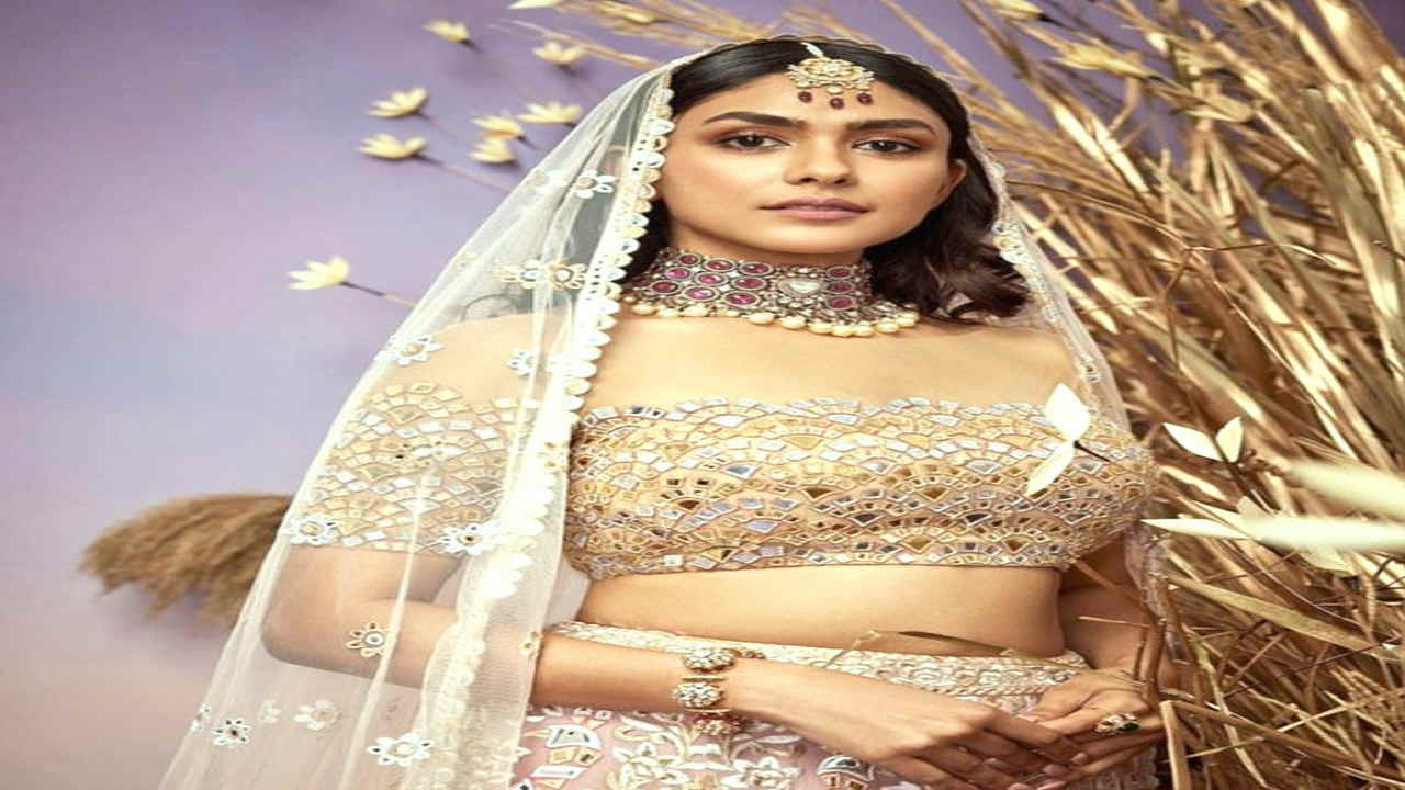 Mrunal Thakur looked like a princess as she walked the runway in an exquisite lehenga with mirror work for the Abu Jani Sandeep Khosla Fashion Show